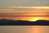 21 December 2011 - The sun is seen setting behind the Southern Gulf Islands, in Delta, B.C., Canada. Credit: Adrian Brown - N49Photo.