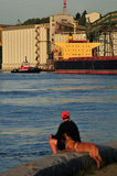 07 May 2012 - The Seaspan Ship Assist Harbour Tugs, Seaspan Hawk, moves into position to help move a cargo ship away from the Cascadia grain terminal, in Vancouver, B.C., Canada. Credit: Adrian Brown - N49Photo.