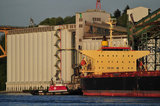 07 May 2012 - The Seaspan Ship Assist Harbour Tug, Seaspan Hawk, helps move the cargo ship, St. Nikon, away from the Cascadia grain terminal, in Vancouver, B.C., Canada. Credit: Adrian Brown - N49Photo.