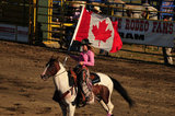 03 August 2012 - A rodeo queen carries the Canadian flag at the Abbotsford Agrifair & Rodeo, in Abbotsford, B.C., Canada. Credit: Adrian Brown - N49Photo.