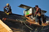 07 September 2012 - Workers are seen finishing the roof of a new home at a construction site in Surrey, B.C., Canada. Credit: Adrian Brown - N49Photo.