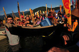 01 September 2012 - People listen to others speak during a ceremony at Whey-Ah-Wichen (Cates Park), after travelling a ceremonial route by canoe from West Vancouver's Ambleside beach, in North Vancouver, B.C., Canada. The "Gathering of Canoes to Protect the Salish Sea" event, co-hosted by Squamish First Nation and Tsleil-Wauth First Nation, celebrated teachings of the canoe, future generations, unity of peoples, and reaffirmed each nation's responsibility to protect and maintain their sacred connection to the waters of the Salish Sea. The event was organized in opposition to the proposed expansion of the Kinder Morgan pipeline and tanker terminal, that could see increased super tanker traffic on Burrard inlet in Port Metro Vancouver. Credit: Adrian Brown - N49Photo.