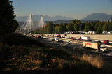 18 September 2012 - Traffic travels east bound in three lanes (left) that opened today on the new Port Mann Bridge, connecting Surrey with Coquitlam over the Fraser River, in Surrey, B.C., Canada. The bridge is a cable-stay structure that will support ten traffic lanes when fully open, and is reportedly the widest bridge in the world. Credit: Adrian Brown - N49Photo.