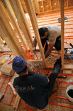 20 September 2012 - Gurgit Nijjar, right, and Ranjit Singh Sandhu prepare to install a series of valves on the second floor of a new home, where they will be used in the property's Hydronic Radiant Floor Heating system, at a construction site in Surrey, B.C., Canada. Credit: Adrian Brown - N49Photo.