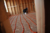 20 September 2012 - Ranjit Singh Sandhu, installs Radiant PEX tubing on the second floor of a new home, where it will be used in the property's Hydronic Radiant Floor Heating system, at a construction site in Surrey, B.C., Canada. Credit: Adrian Brown - N49Photo.