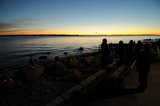 11 January 2012 - People gather to look at balanced stones by John J. Shaver, on the beach beside the ocean front promenade, in West Vancouver, B.C., Canada. Credit: Adrian Brown - N49Photo.