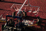 05 October 2012 - Workers corrall cranberries and feed them into a machine, in a flooded field at a farm owned by Richberry Group of Companies, reportedly the largest grower in Canada, in Richmond, B.C., Canada. Credit: Adrian Brown - N49Photo.