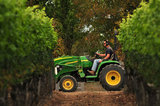 01 October 2012 - Scott, a vineyard assistant, uses a tractor to move large bins of freshly picked Siegerrebe grapes, at Domaine de Chaberton Estate Winery, in Langley, B.C., Canada. The Siegerrebe white wine grape, a cross between Madeleine Angevine and GewÃ¼rztraminer, has a light red or pink coloured skin, and will be used by the winery to make a varietal white wine. Credit: Adrian Brown - N49Photo.