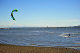 25 September 2013 - White Rock, B.C., Canada - A man kiteboards in front of East Beach, on the Semiahmoo First Nation reserve just south of the city of White Rock. Drayton Harbor and the US coastline are seen in the distance, in Blaine, WA, centre left. Photo Credit: Adrian Brown / Sipa Press.